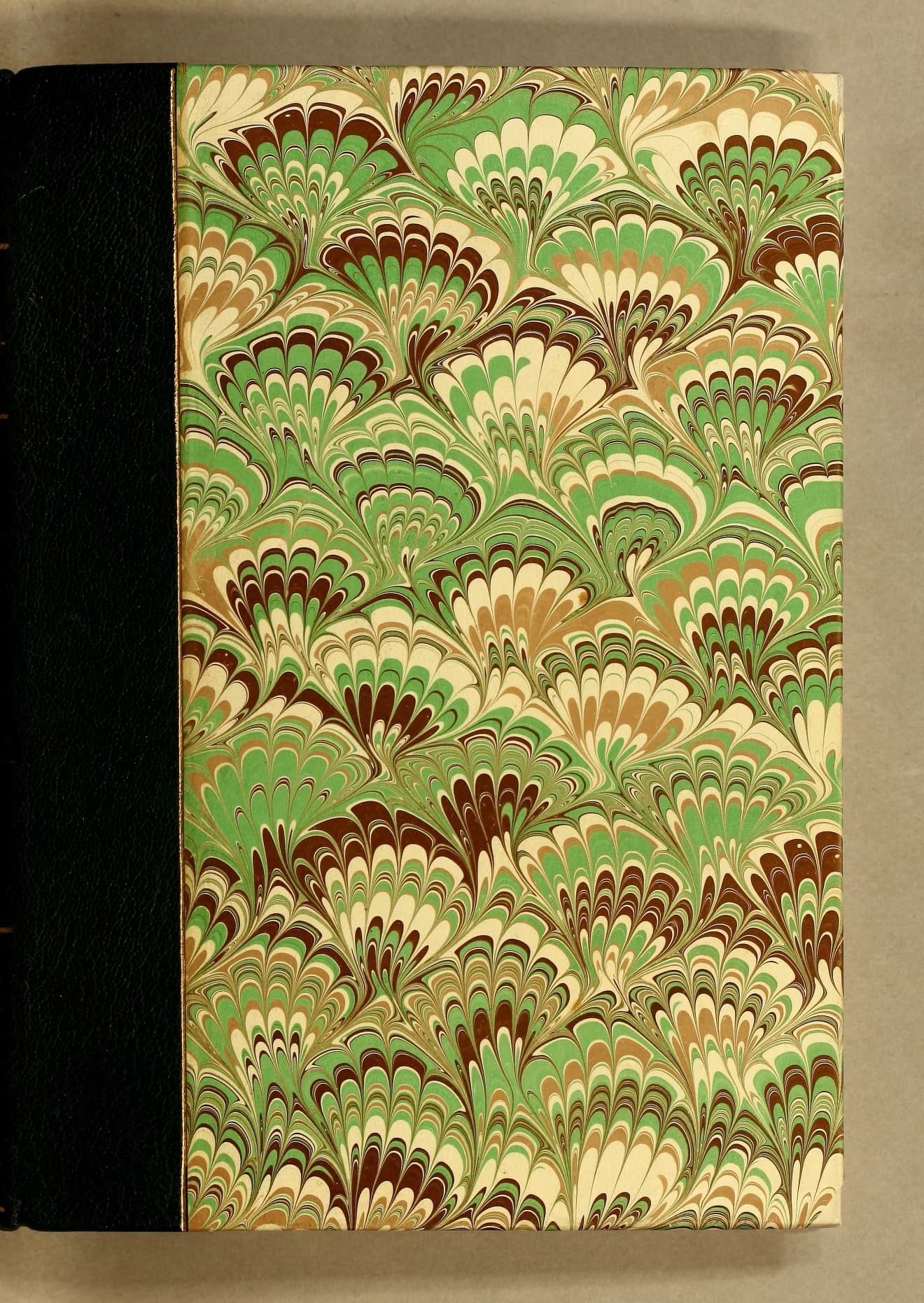A historic book cover decorated with marbled paper