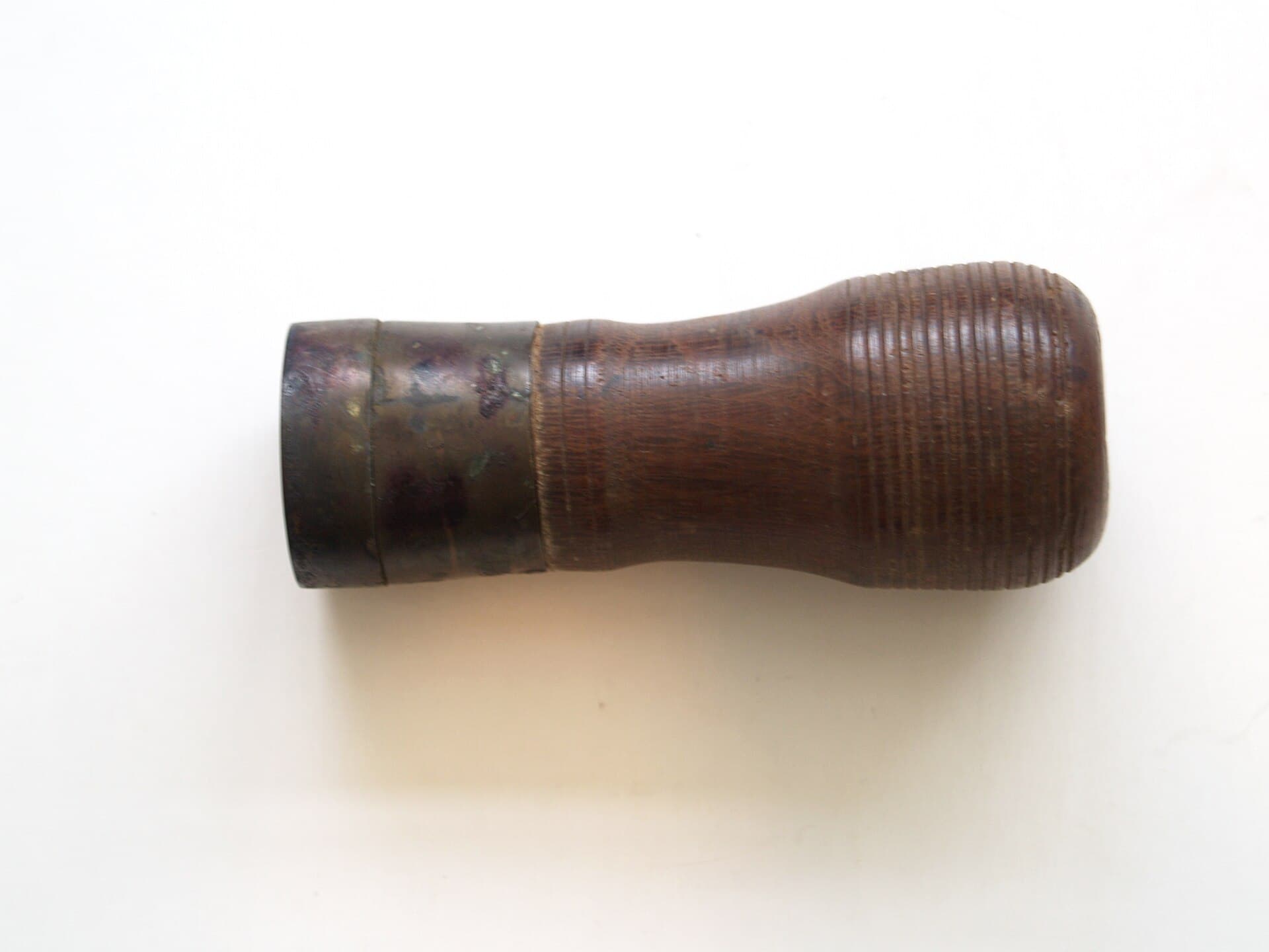 A brass seal and a stick of sealing wax